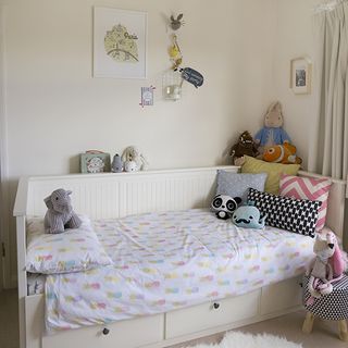 children's bedroom with bed and toys