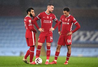Liverpool’s (from left to right) Mohamed Salah, Jordan Henderson and Trent Alexander-Arnold appear dejected during the Premier League match at the Etihad Stadium, Manchester