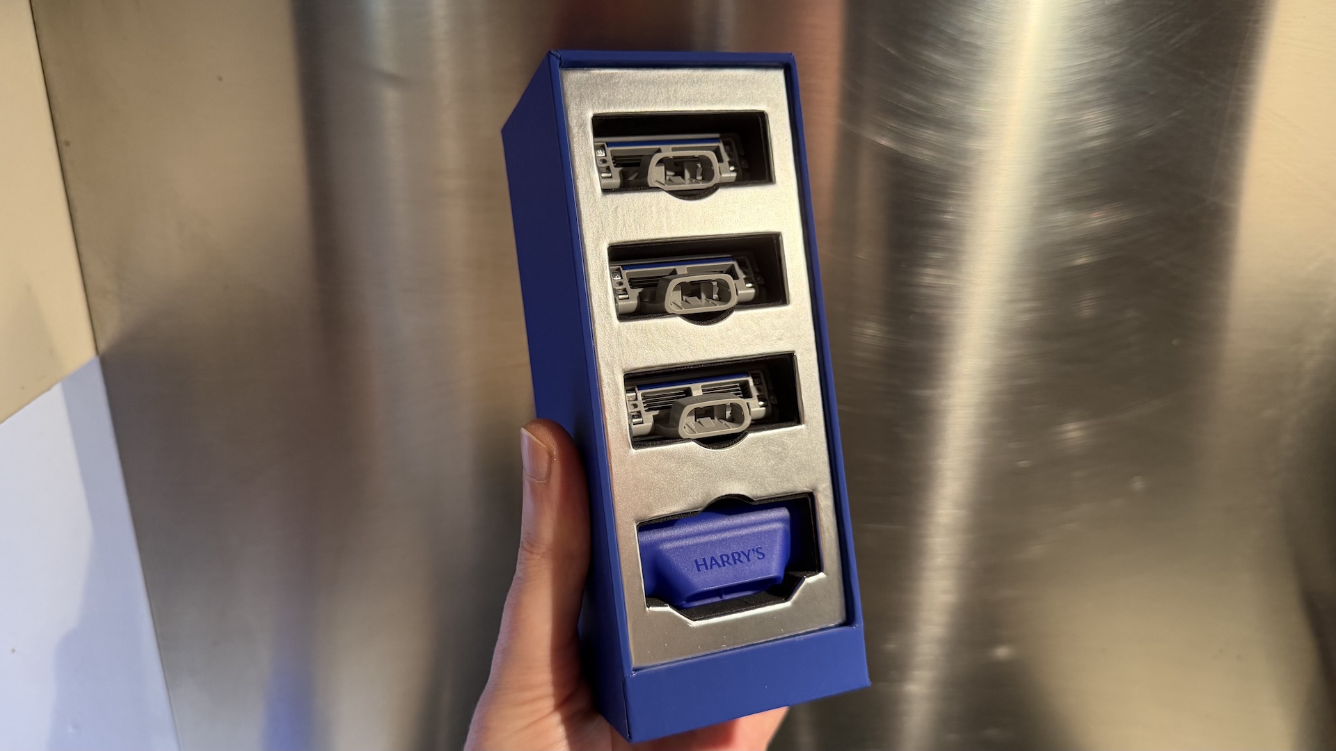 The Harry&#039;s Plus Razor against a stainless steel background