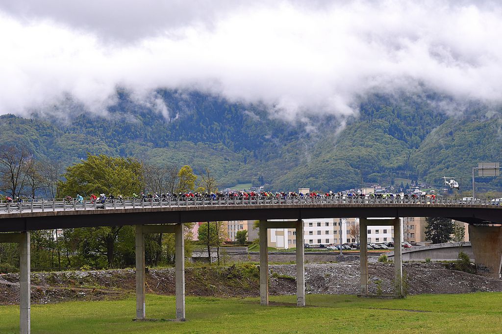 The riders crossing a bridge