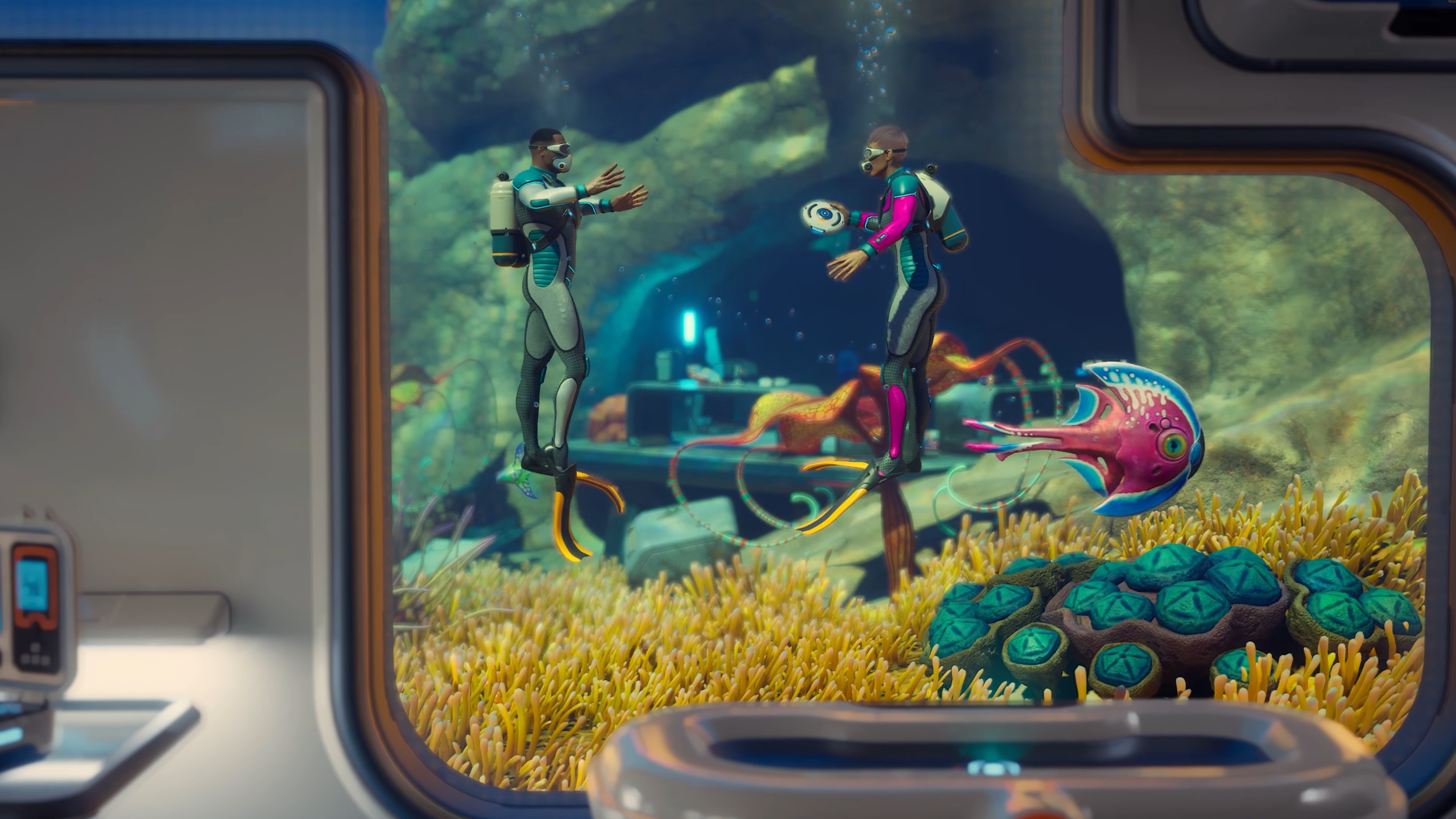 Subnautica 2 screenshot from Buddy System update 1.2 trailer showing two divers talking to each other outside a cave and underwater base
