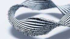 A twisted black and white striped ribbon is covered with small black and white dots against a white background