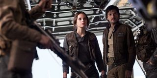 Jyn Erso (Felicity Jones) and Cassian Andor (Diego Luna) looks on in Rogue One: A Star Wars Story (2016)