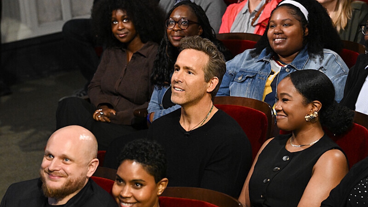 Ryan Reynolds smiling in the audience of The Late Show 
