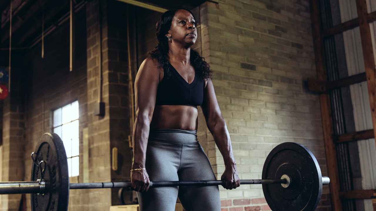 Woman doing barbell exercise