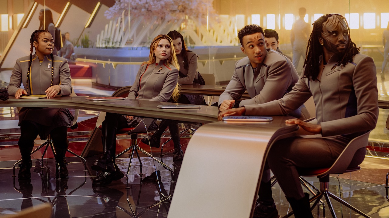 Sam, Genesis, Caleb, Jay-Den, Tamira and Ocam seated inside of a classroom in Star Trek: Starfleet Academy