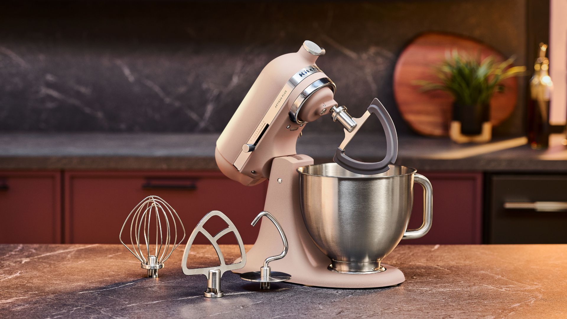 The KitchenAid Artisan Plus Tilt-Head 4.7L Stand Mixer with accessories