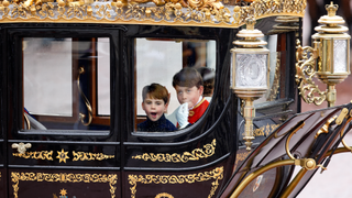 Prince Louis of Wales and Prince George of Wales (in his role as Page of Honour) return to Buckingham Palace in The Australian State Coach following King Charles III's and Queen Camilla's Coronation service at Westminster Abbey on May 6, 2023 in London, England