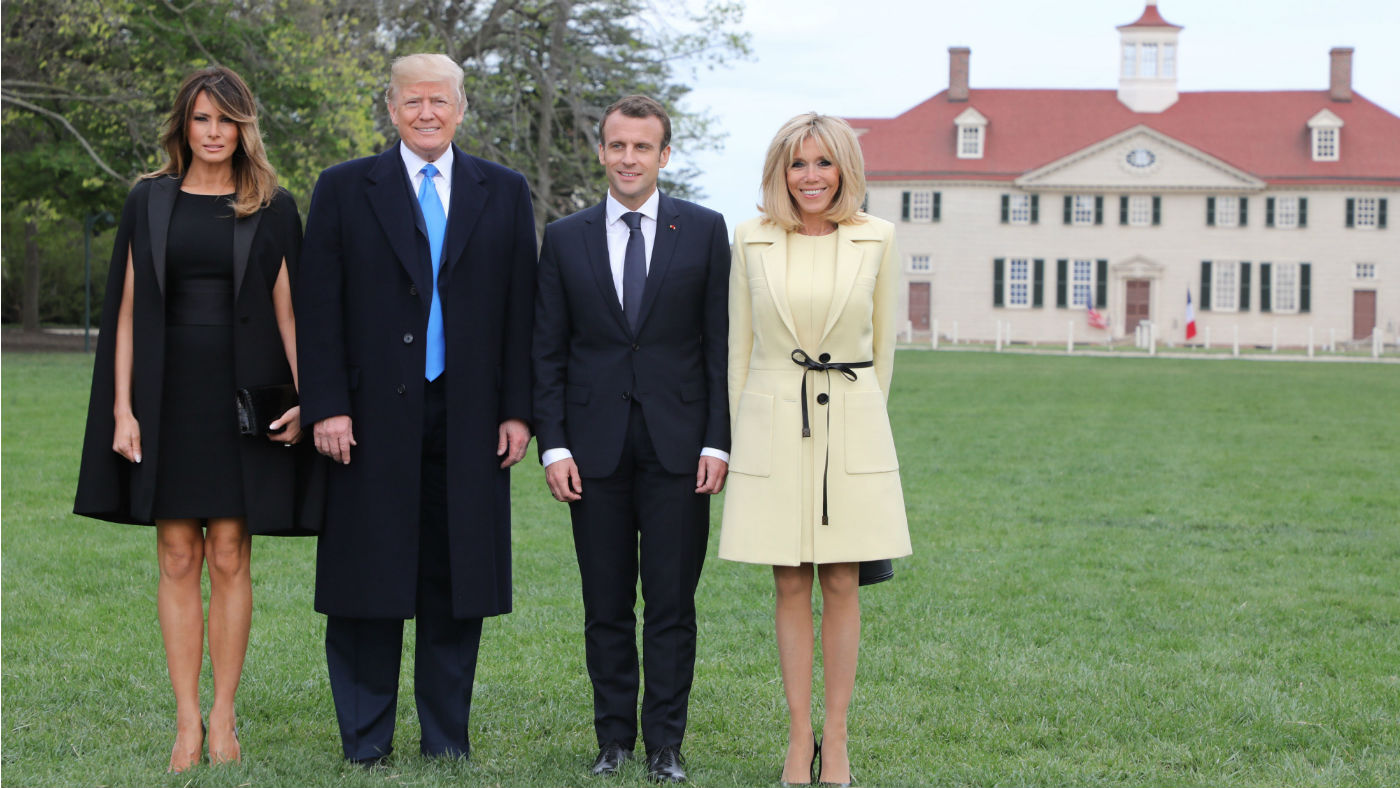 Melania and Donald Trump pose alongside Emmanuel Macron and his wife Brigitte