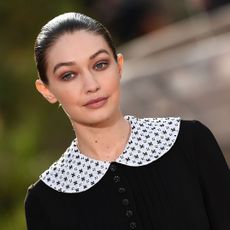 us model gigi hadid presents a creation by chanel during the womens spring summer 20202021 haute couture collection fashion show at the grand palais in paris, on january 21, 2020 the grand palais was turned into the garden of the cistercian abbey in aubazine, central france, where gabrielle coco chanel grew up photo by christophe archambault afp photo by christophe archambaultafp via getty images