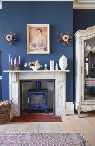 blue living room with matching log burner ideas
