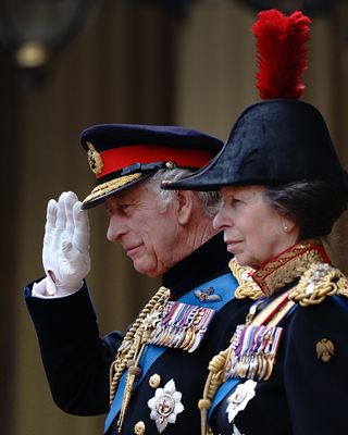 King Charles III, accompanied by Princess Anne, the Princess Royal, presents the new Sovereign's Standard
