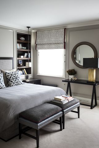 Monochrome bedroom with black furniture
