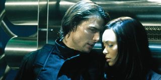 Mission: Impossible 2 Tom Cruise and Thandie Newton hiding behind some pipes