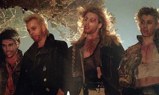 Mulleted Kiefer Sutherland with other vampires in The Lost Boys