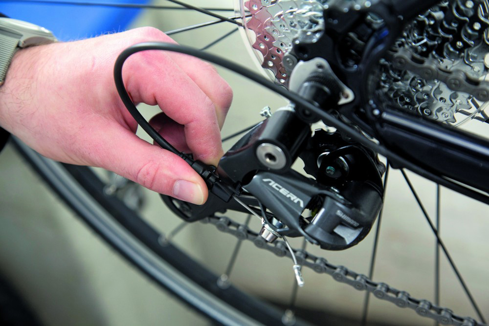 adjusting a rear derailleur on a mountain bike