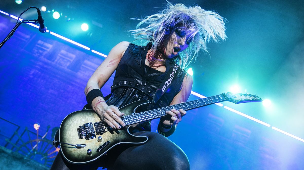 Alice Cooper&#039;s guitarist Nita Strauss performs on stage at Resorts World Arena on October 11, 2019 in Birmingham, England