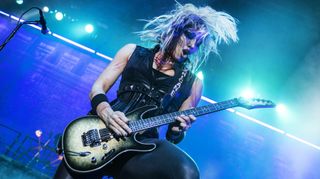 Alice Cooper's guitarist Nita Strauss performs on stage at Resorts World Arena on October 11, 2019 in Birmingham, England