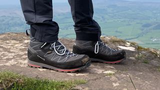 Person's feet wearing Aku Trekker Lite III GTX hiking boots