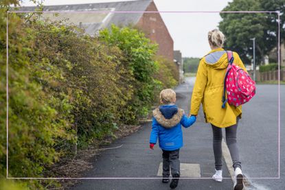 Mum walking away from school with her child