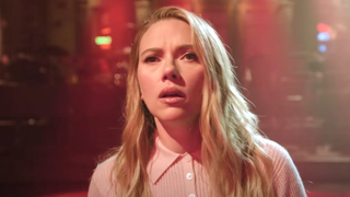 Scarlett Johansson looking worried in Jurassic Park SNL promo spoof