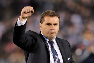 Ange Postecoglou celebrates with a raised fist while managing Melbourne Victory, 2013