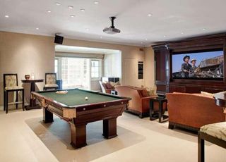 living room with pool table and tv