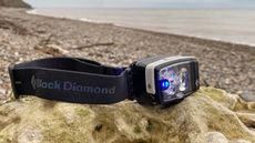 Black Diamond Distance LT1100 on a rock on a beach