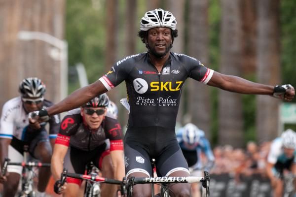 Bahati raises his arms with a dominant sprint victory.