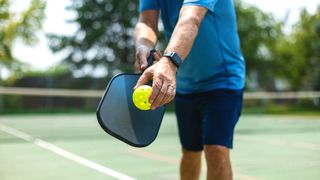a photo of a man playing pickleball