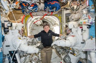 NASA astronaut Peggy Whitson (center) poses with crewmates Shane Kimbrough of NASA (right) and Thomas Pesquet of the European Space Agency ahead of a Jan. 13, 2017 spacewalk outside the International Space Station. Kimbrough and Pesquet are taking another