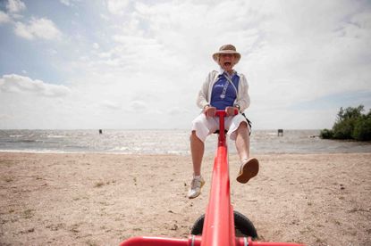 older man on a see-saw