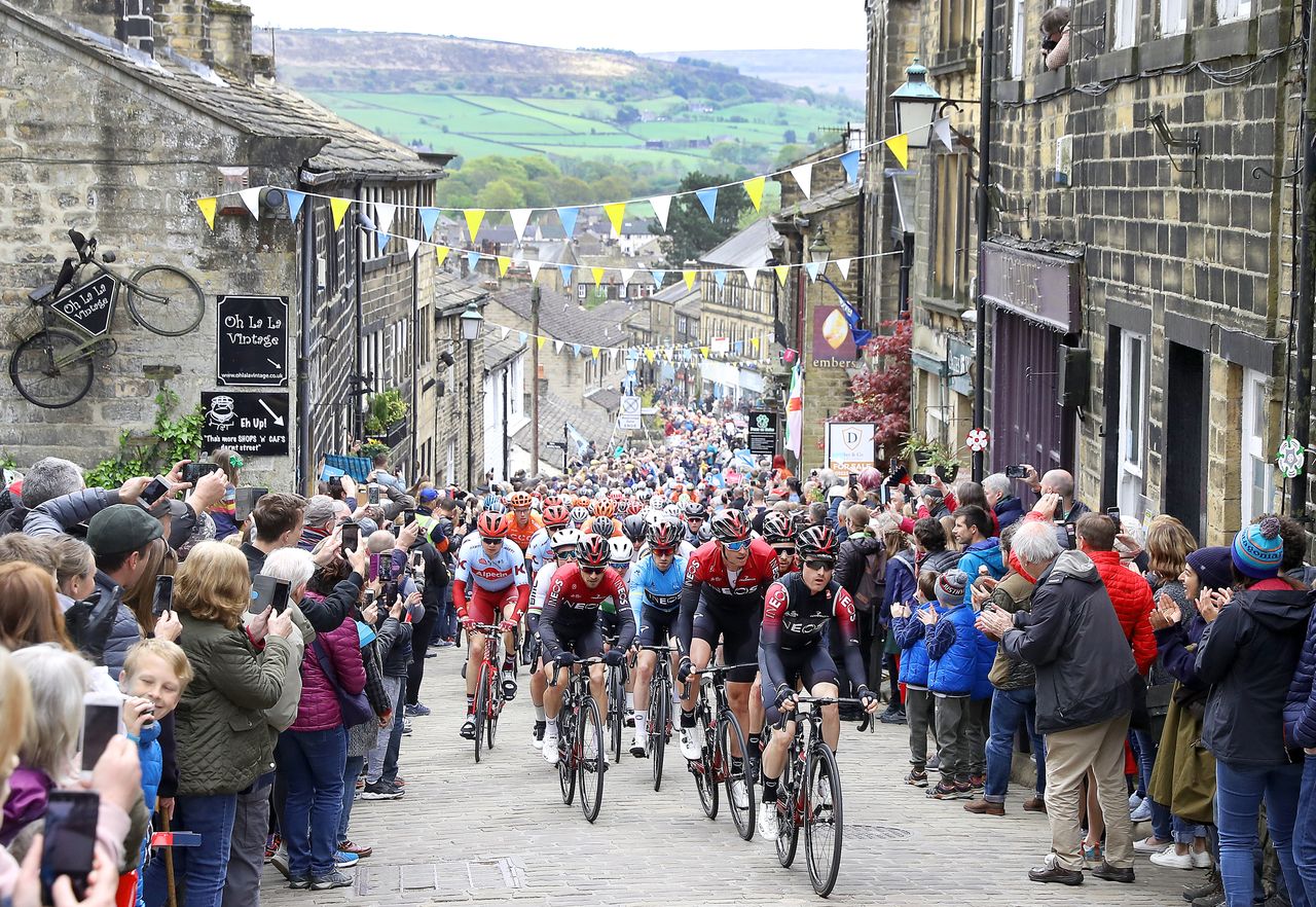 The 2019 Tour de Yorkshire riding up Haworth Main Street