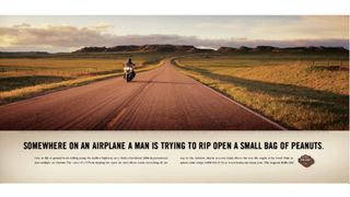 Print ad for Harley featuring motorcyclist on long empty road