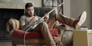 Zayn Malik Wrong music video with guitar on chair