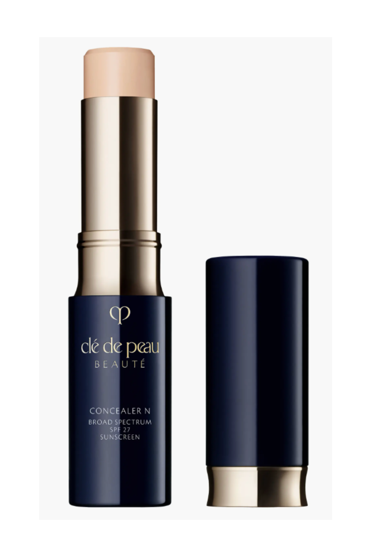 a blue and gold tube with tan concealer