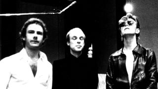 Robert Fripp, Brian Eno and David Bowie pose for a portrait in the studio where they are recorded "Heroes" in 1977 in Berlin, Germany