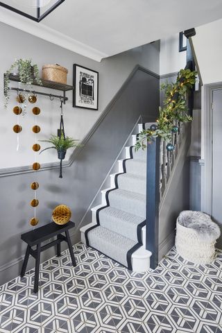 grey hallway with patterned flooring and christmas decorations