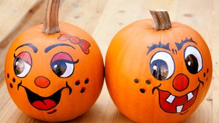 Painted faces on Halloween pumpkins