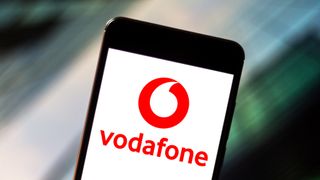 A mobile phone showing the Vodafone logo