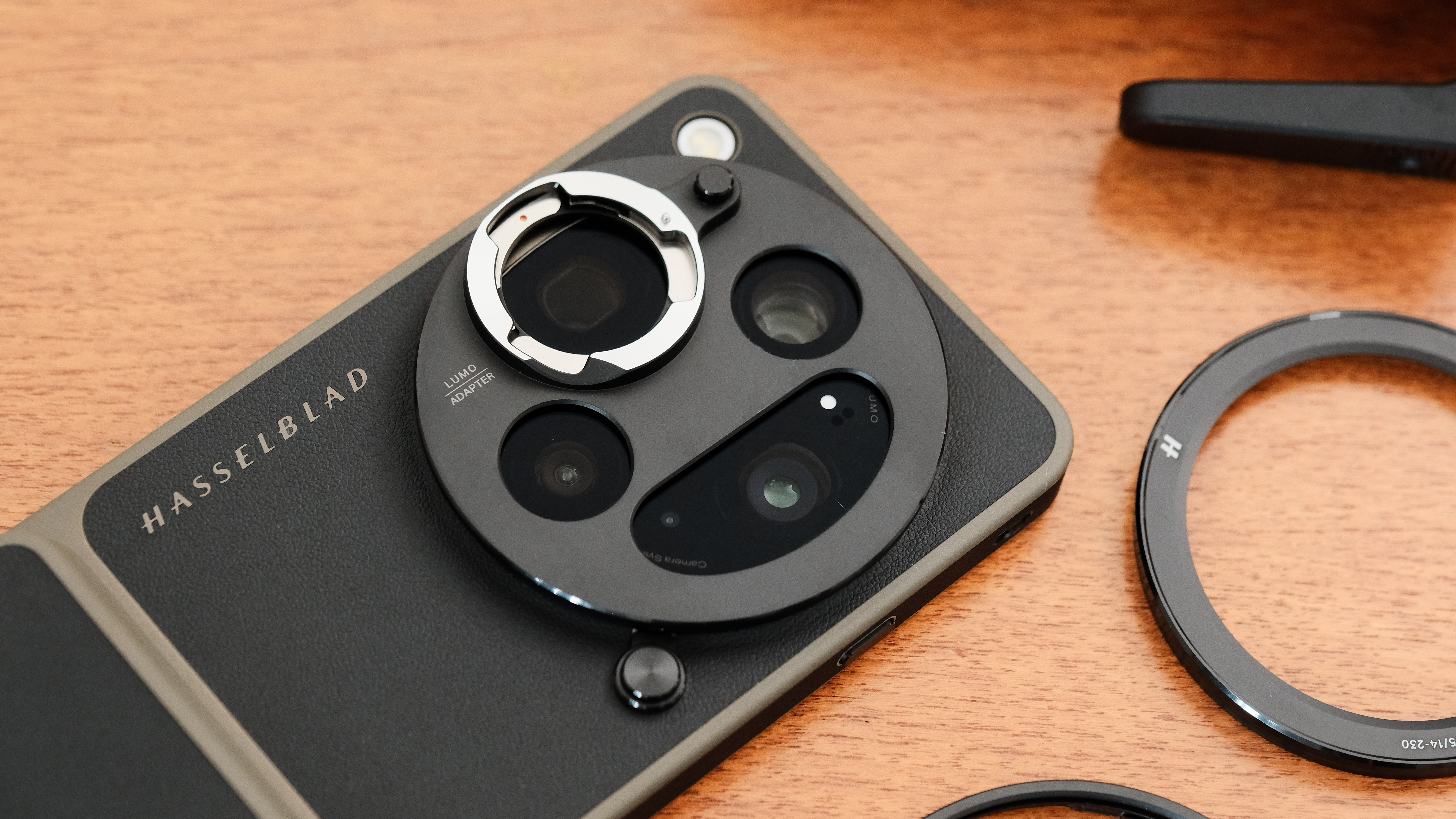 Close-up of the Lumo adapter mounted over the Oppo Find X9 Ultra cameras