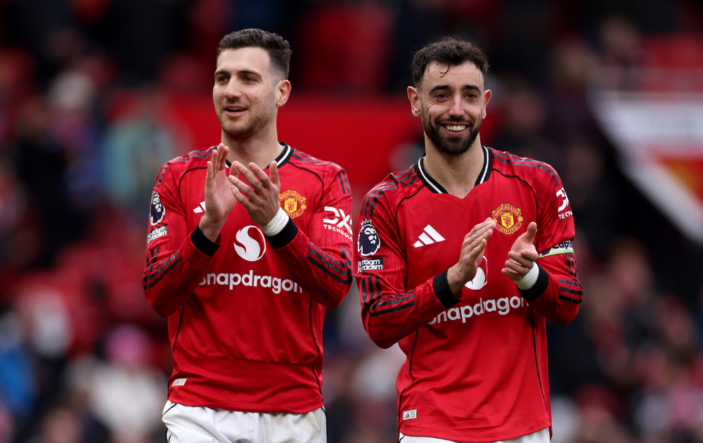 Diogo Dalot and Bruno Fernandes of Manchester United acknowledge the fans after the Premier League match between Manchester United and Aston Villa at Old Trafford