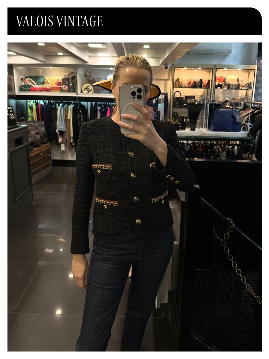 a selfie wearing a Chanel jacket inside Valois Vintage, one of the best vintage stores in Paris