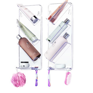 A pair of clear acrylic storage shelves with diagonally stacked toiletries