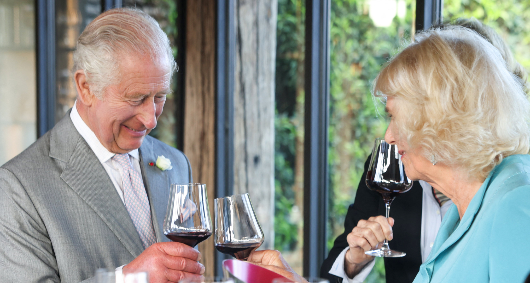 King Charles and Queen Camilla toasting with winte