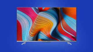 4K smart TV on a blue TechRadar deals background
