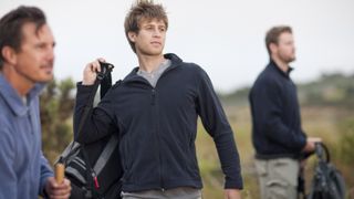 Men wearing fleece jackets on a hike