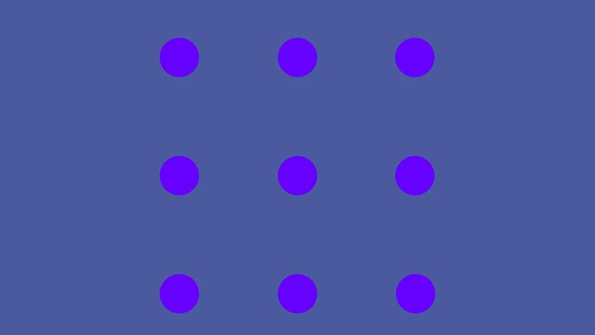 An optical illusion showing nine purple dots that seem to change colour on a bluish purple background