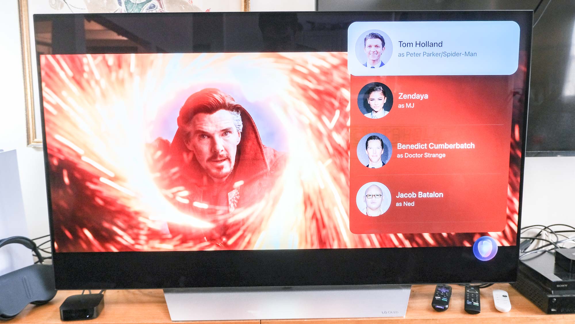 Benedict Cumberbatch as Doctor Strange in Spider-Man: No Way Home, appears next to a cast list on a TV connected to the Apple TV 4K (2022)