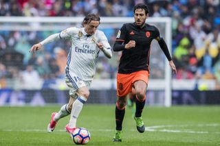 Luka Modric on the ball for Real Madrid in a La Liga game against Valencia in 2017.